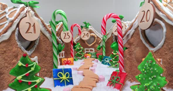 Gingerbread cottage with candies and cookies. Gingerbread village for Christmas.