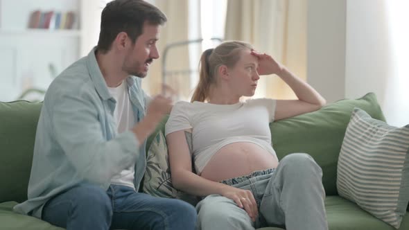 Upset Pregnant Couple Having Argument at Home