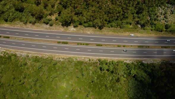 Traffic motion on a highway road in the mountains. 