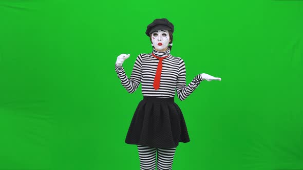 Mime Girl Is Eating Something, Showing Thumbs Up. Chroma Key