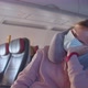 Lady with Blue Disposable Face Mask Sleeps on Plane Chair - VideoHive Item for Sale