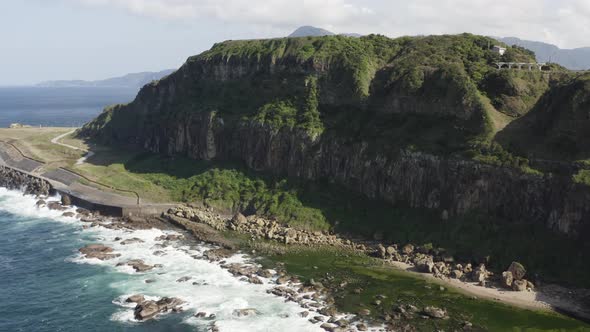 Aerial Cinematic Nature waves, ocean and Rocks Formations Keelung Wangyou Valley Taiwan.