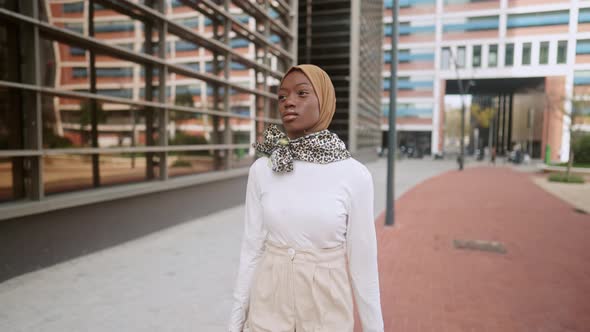 Stylish Muslim Woman Walking on Street