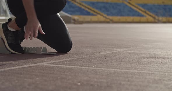 Cropped Runner Preparing for Race