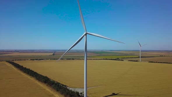 Aerial View of Windmills Rotating By the Force of the Wind and Generating Renewable Energy. 