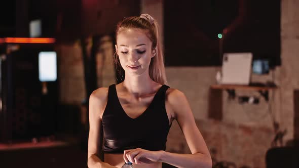 Attractive Sporty Woman Drinking Water