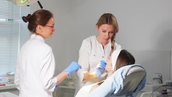 Pleasant Cosmetologists Enjoying Working Process in the Clinic