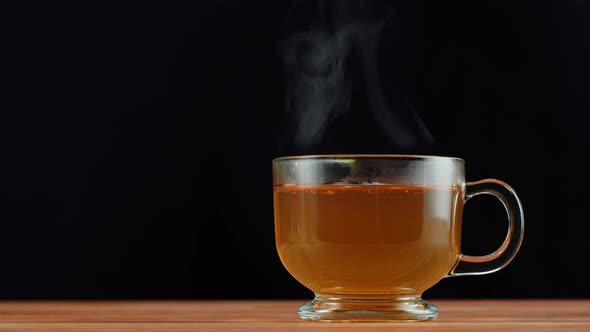 Hot Green Tea on Black Background