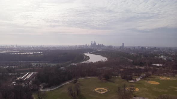 Philadelphia skyline hyperlapse from Fairmount Park over Schuylkill River on sunny, cloudy day