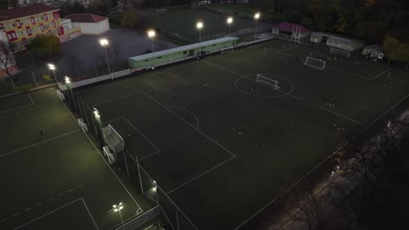 Night Soccer Training on Football Field Aerial View