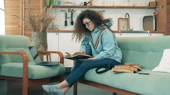 Self-isolating Woman Is Working on a Computer From Home. COVID-19 Lockdown Concept.