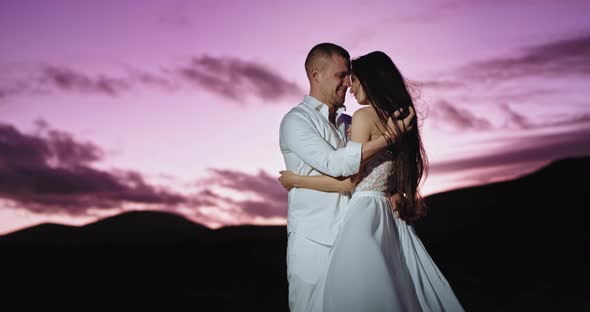 Attractive Couple at Sunset in the Middle of