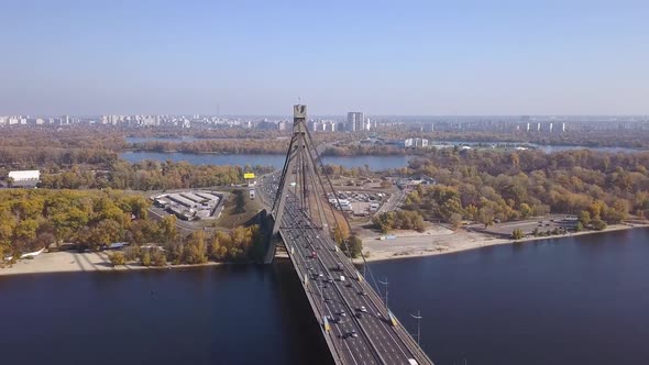 Aerial: Traffic on Pivnichniy bridge in Kiyv, autumn time