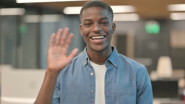 Young African American Man Waving Welcoming