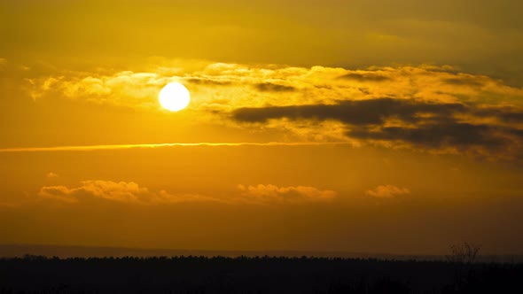 Dramatic Sunset in the Sky Through Orange Layered Cumulus Clouds Timelapse