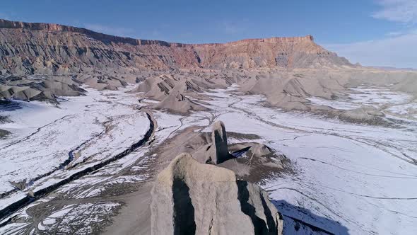 Aerial view flying over desert rock formation in OHV area