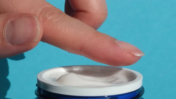 Hands Taking Natural Moisturizing Cream