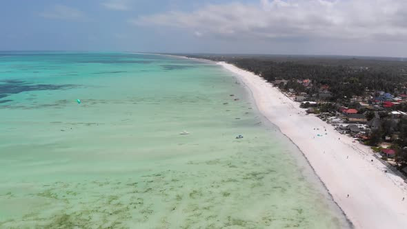 Ocean Coastline with Paradise Beach Hotels and Palm Trees Zanzibar Aerial View