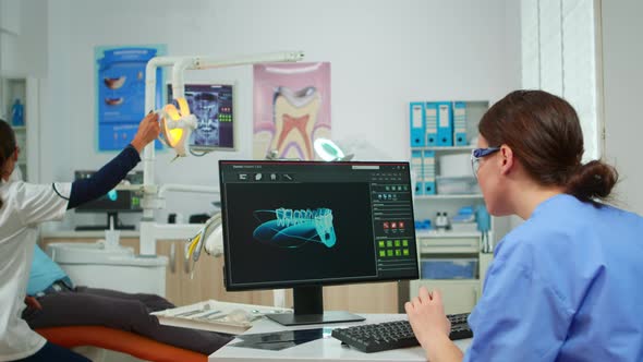 Nurse Working at Digital Dental Fingerprint of Patient