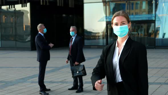 Portrait of Positive Young Businesswoman in Face Mask Doing Thumbs Up Business During Lockdown