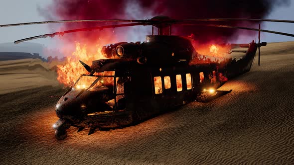 Burned Military Helicopter in the Desert at Sunset