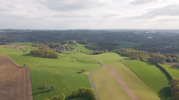 Stunning green fields in North Rhine-Westphalia in the rural countryside of Germany, Europe. Wide an