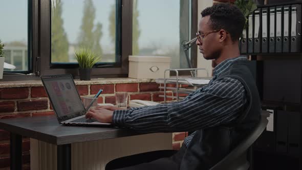 Portrait of Office Worker Browsing Internet to Plan Leadership Innovation