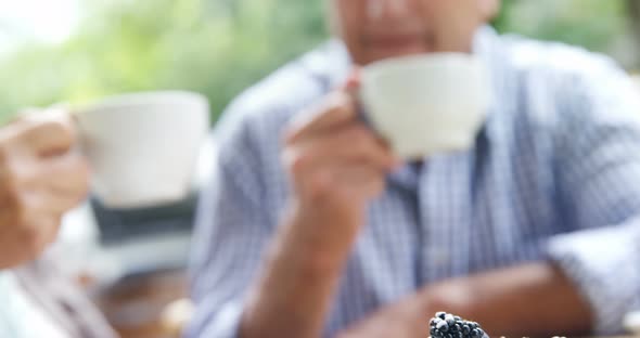 Senior couple having coffee in cafe 4k