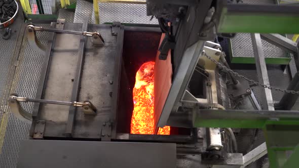 While melting metal in the factory