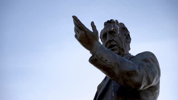 Closeup of a statue of a man in the park