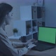 Girl in the Night Office Working on a Laptop with a Green Screen - VideoHive Item for Sale