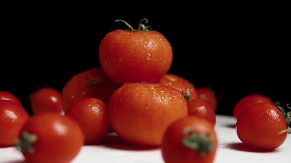 Fresh Washed Red Tomatoes on the Black Background