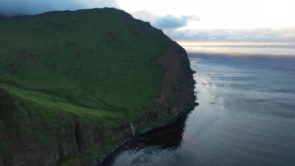 Aerial view of a waterfall at Driftwood Bay, Unalaska, Alaska, United States.