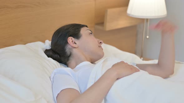 Relaxed Young Indian Woman Sleeping in Bed Peacefully