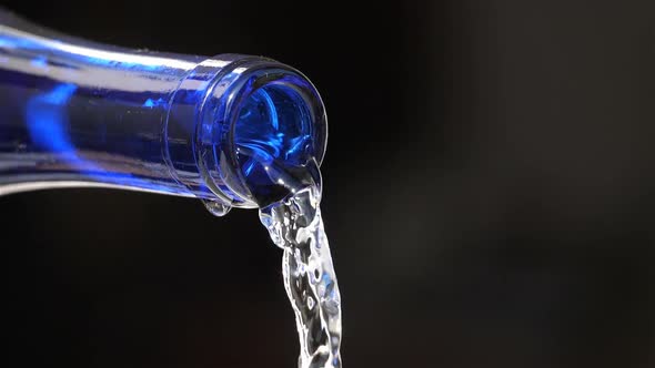 Water Pouring From a glass Bottle