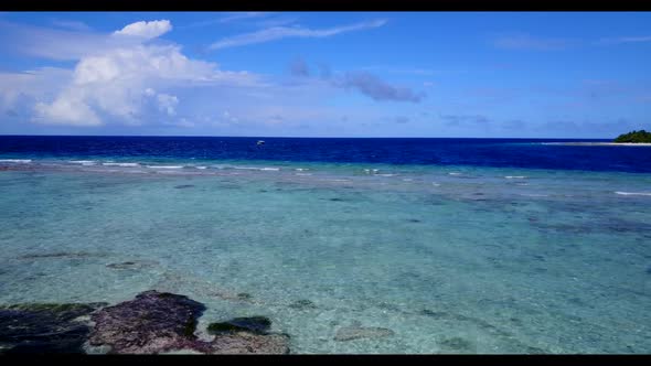 Aerial drone landscape of marine sea view beach journey by blue lagoon with bright sandy background 