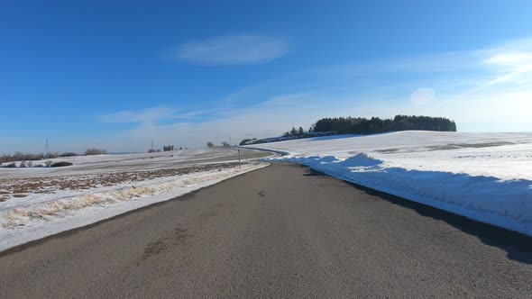 Car drive in winter, sunny day 