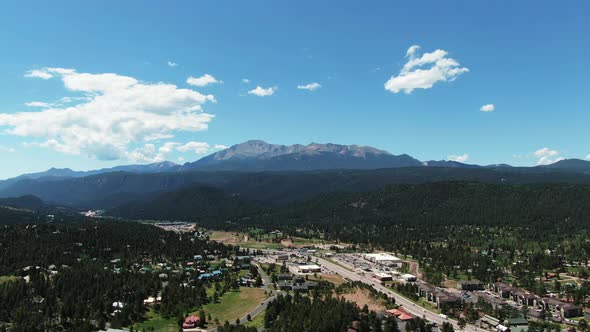 Aerial Footage Left to Right Over Suburbs of Colorado,  Pikes Peak in Background