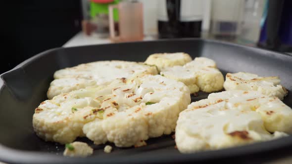 Raw Slices of Cauliflower in Frying Pan