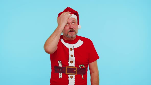 Upset Man in Christmas Red Tshirt Making Face Palm Gesture Feeling Bored Disappointed Bad Result