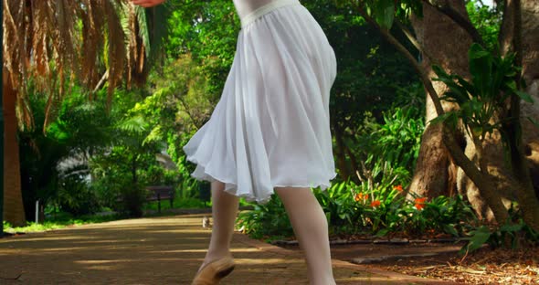 Female dancer practicing dance in park 4k