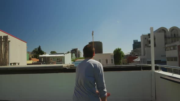 Caucasian man practicing parkour