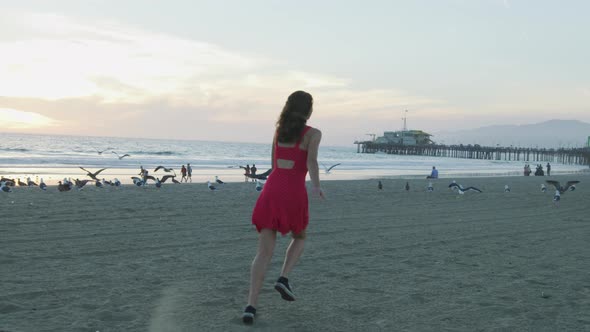 Girl running on Santa Monica beach