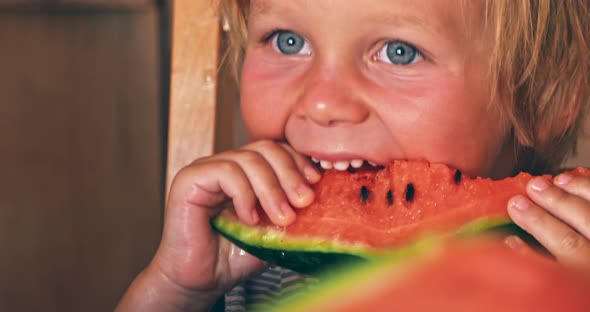 Happy Child with Big Red Slice of Watermelon