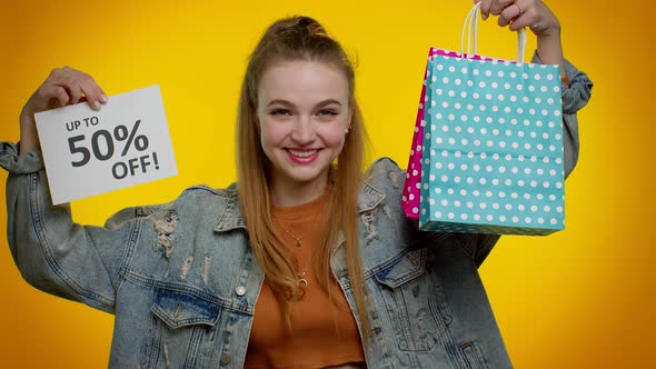 Cheerful Teen Girl Showing Shopping Bags and Up To 50 Percent Off Inscriptions Banner Black Friday