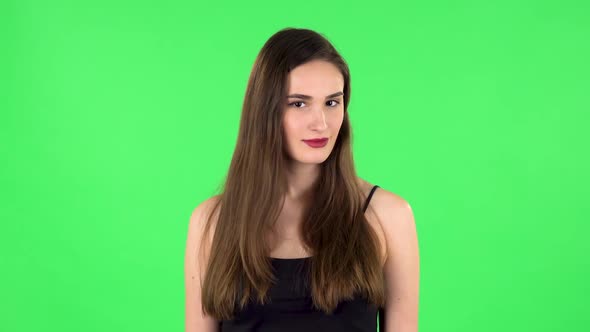 Girl Threatens with a Fist. Green Screen