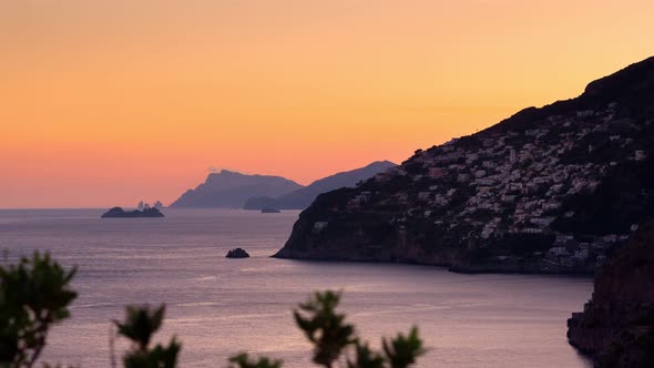 Timelapse video of sunset on the Amalfi Coast with the small town of Praiano on the left.
