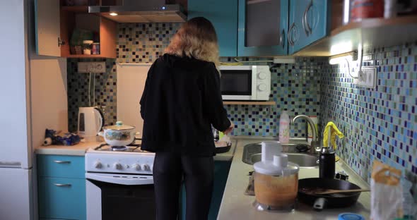 Home Routine Woman Preparing Food on Kitchen