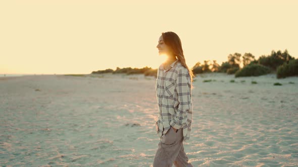 Happy Beautiful Mixed Race Woman Hipster Enjoying Walk on Wild Sea Sand Beach at Sunset with