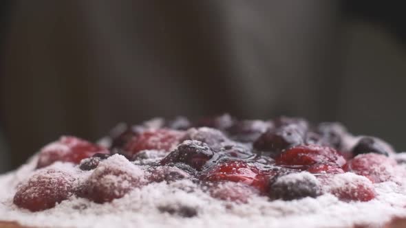 Powdered Sugar is Poured on a Cake